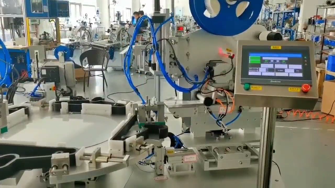 Automatic clothes hanger labeling strapping machine