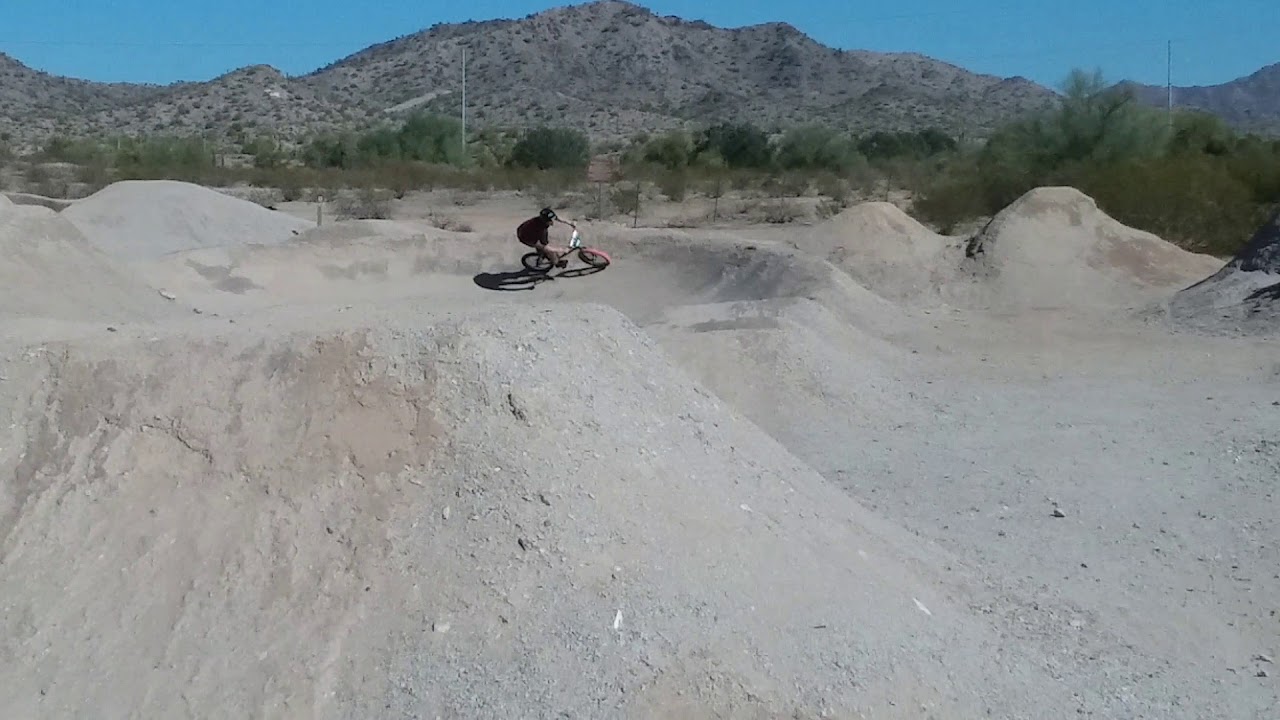 Goodyear Arizona dirt park jumping over Gold bike