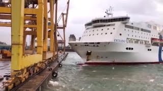 Ship crashes into crane at port causing huge fire