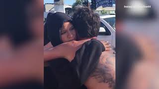 Cassie hugs fiance Alex Fine after he finishes charity run