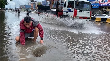 Prevent Rain Storm Flooding with clearing Trash Debris clogged Culvert Drain on the long road 