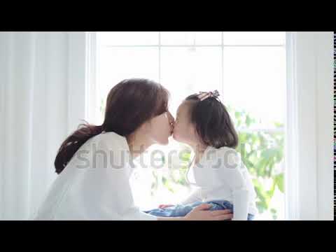 stock footage beautiful asian mom and her cute daughter kissing with love while looking at each othe