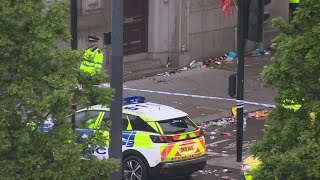 Driver arrested after plowing into parade crowd in England
