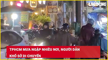 TPHCM mưa ngập nhiều nơi, người dân khổ sở di chuyển| Báo Lao Động