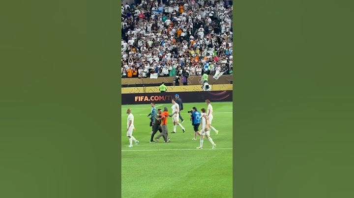 Real Madrid fan running to take a selfie with Modric at the end of the Real Madrid big game Salzburg