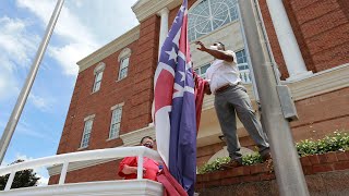 Mississippi governor signs bill to take down state flag featuring Confederate emblem