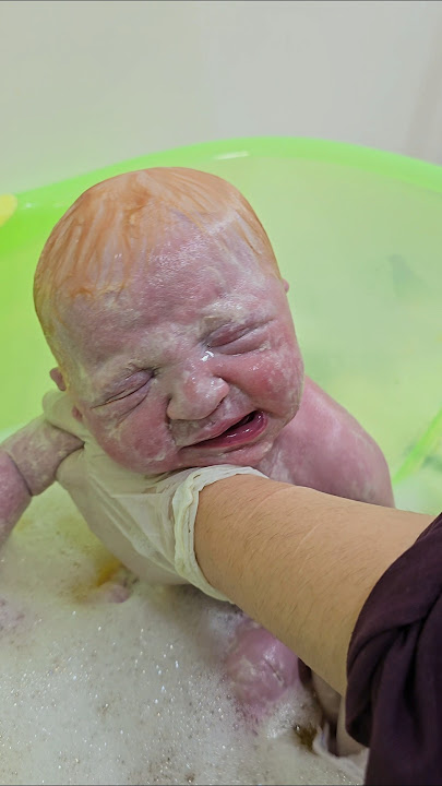 blond baby first bath