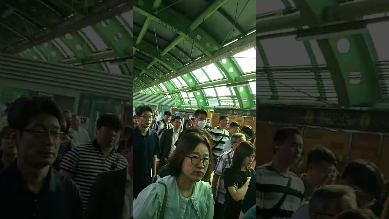 Getting off a subway to transfer to another. They are commuters, only 30% of the people in 3 cars.