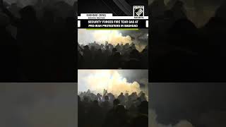 Security forces fire tear gas at pro- Iran Protestors in Baghdad near US Embassy