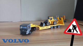 Unboxing Volvo Fmx Lowbed Trailer With Volvo 130H Loader By Majorette