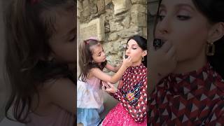 Nora Fatehi ❤️ is getting her lipstick applied by a cute little girl  😘 #norafatehi #newsong