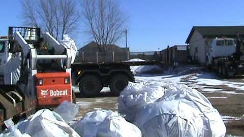 Loading Load-a-Bags with Bobcat S300 onto Sterling Truck