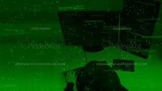 Hacker programmer typing code on green terminal computer monitor