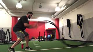 Split stance double hand battle rope waves