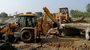Two JCB Backhoe Machine Trying To Break and Throw out Old Concrete Culvert For New Bridge.- Part- 2