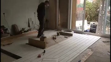 Laying of underfloor heating overlay system.