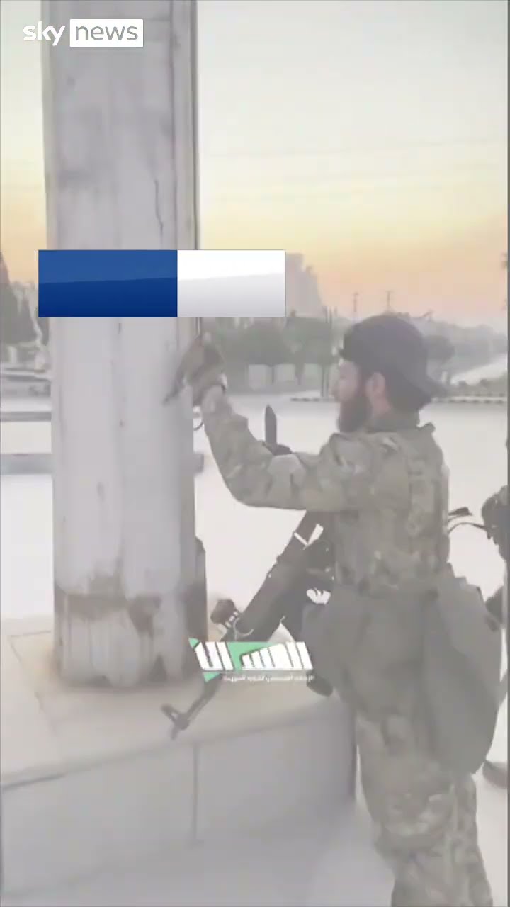 Syrian rebels take down flag from monument in Aleppo