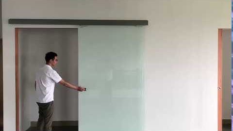 Magnetic drive automatic sliding glass door opener