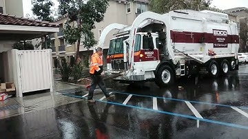 edco front loader on recycle in the rain