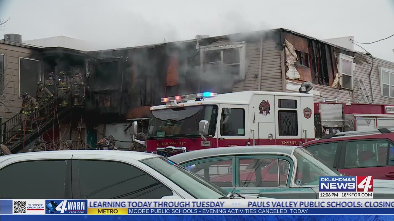 Fire crews battle apartment fire in freezing temps - YouTube