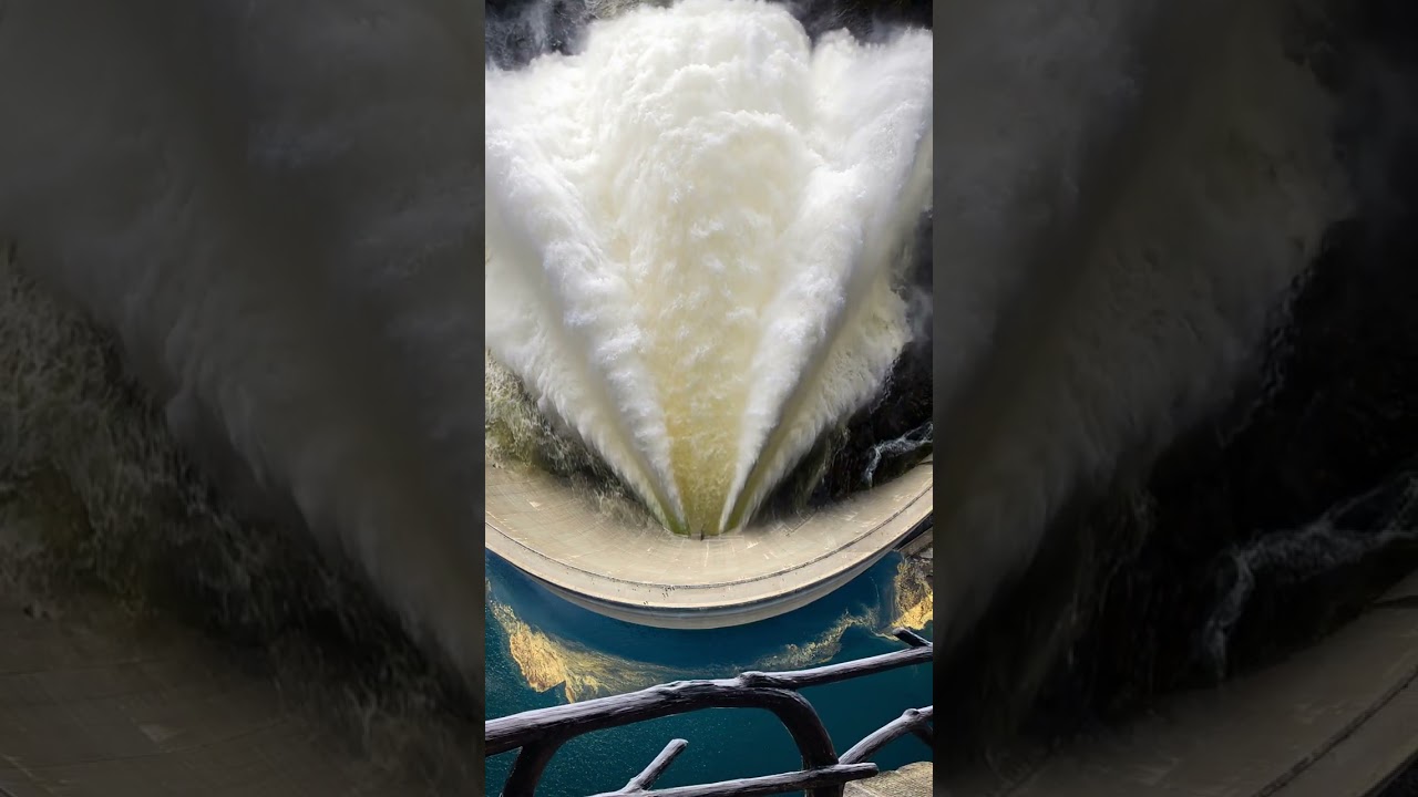 The dam releases water, like thousands of troops galloping down  