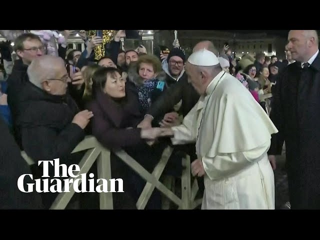 Indignant Pope Francis slaps woman's hand to free himself at New Year's Eve gathering class=