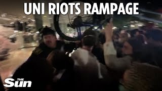 Moment desperate cops push back violent rioters with a BICYCLE during university Gaza protest