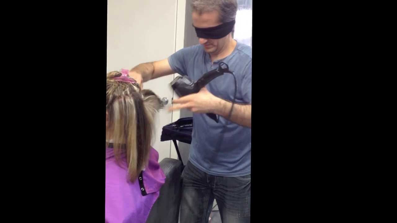 Woman blindfolded, preparing to get a haircut and blowdry