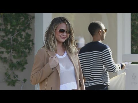 Chrissy Teigen reveals she is pregnant, shows off baby bump