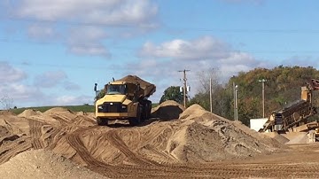 CAT 740 Articulated 6 Wheel Dump in action
