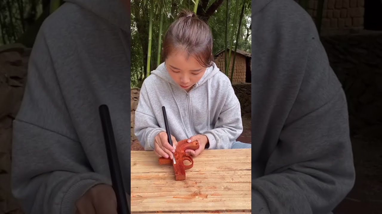 Wood Carving: Wooden Short Gun Carved By A Beautiful Craftswoman