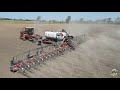 Versatile dt620 tractor pulling a white 9900 32 row corn planter