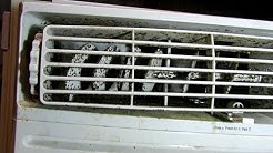 Cleaning mold out of a window AC unit. 