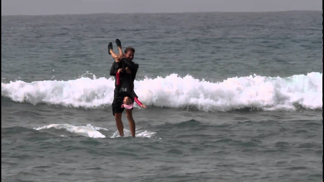 Hans Hedemann Surf Instructor James with 8 yr old Mikiko