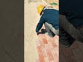 Bricks laid in rows, mallet taps align each piece true