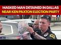 Masked man detained near Paxton election event in Dallas