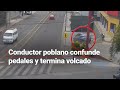 ¡BAJAAAAN! Conductor borracho pierde el control al estacionarse y termina volcado