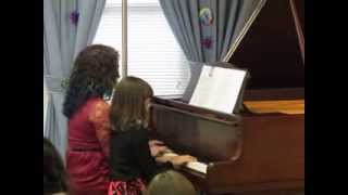 Allison and her teacher play I Saw Three Ships