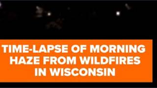 Haze from wildfires descend on Wisconsin in time-lapse video