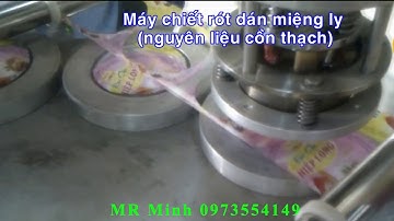 Máy dán miệng ly mâm xoay