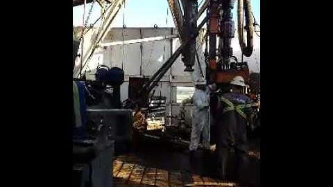 Making connection with iron roughneck and topdrive