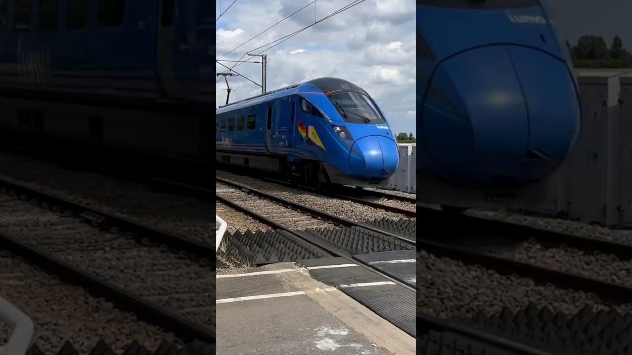 Lumo class 803 passing Cromwell Lane LC