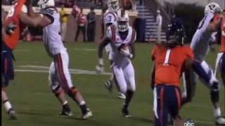 Virginia Tech's David Wilson Stiffarms UVA's Corey Mosley