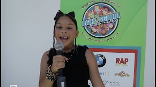 Kid Correspondent Isabella Dives Into MiAsia Symone&#39;s Back-To-School Backpack Drive