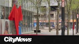 Outdoor exhibition in Toronto marking Red Dress Day