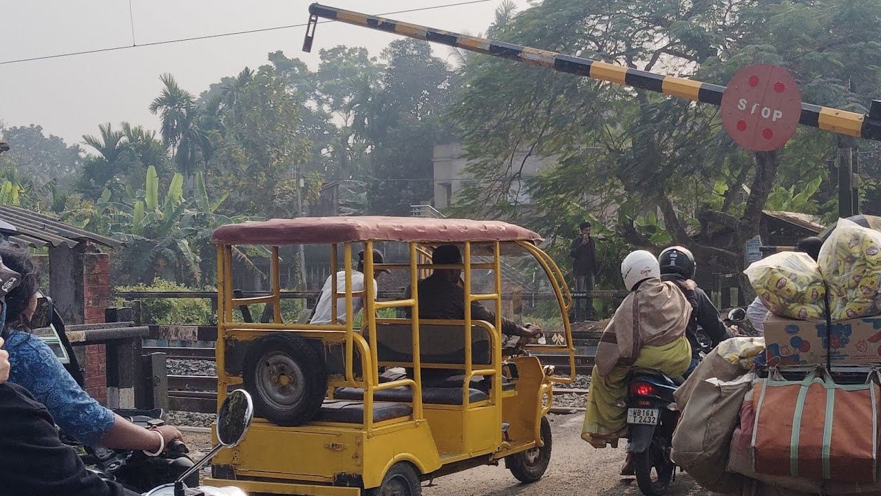 Indian digital railgate, busy railway gate , Express and local train crossing