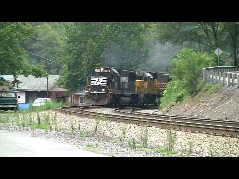 Norfolk Southern EMD SD60, 6700 breaks the silence in the small town of Elkhorn, West Virginia as it leads a unit grain train down the hill with 2 ex Union Pacific SD60's (now HLCX). Helpers 8023 and 8017 assist the train on the long haul into Bluefield, West Virginia. LRF Video Productions