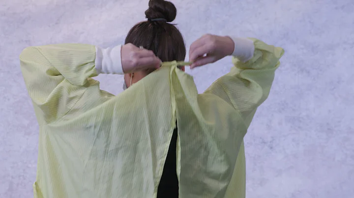 Donning and doffing reusable cloth isolation gowns