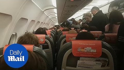 Passengers prepare to disembark after Birmingham flights halted