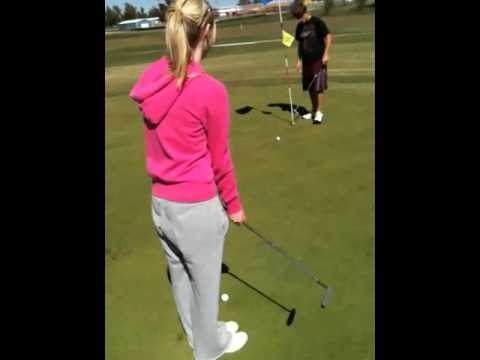 Jessika trying her best to putt